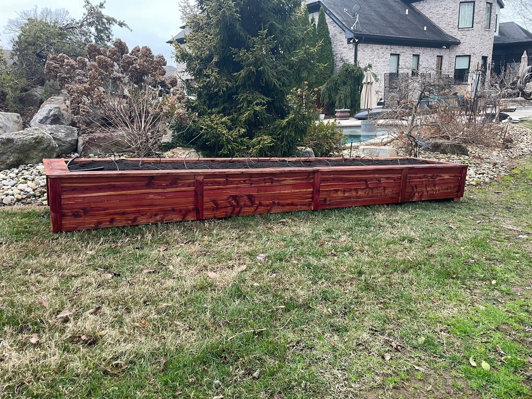 Long custom cedar raised garden bed built by Avodah in Middle Tennessee