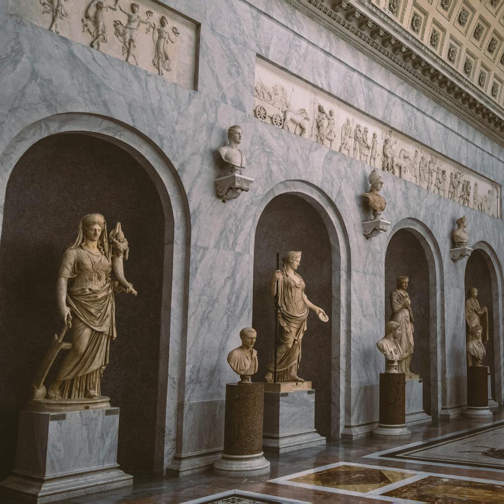Exquisite Roman sculptures in Vatican Museum showcasing ancient artistry indoors.